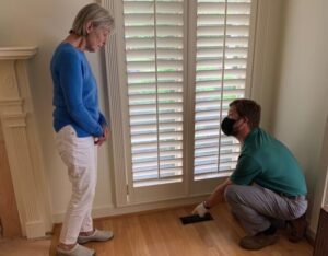 man in gloves and mask showing client duct boot