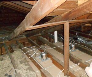 attic with missing and low insulation