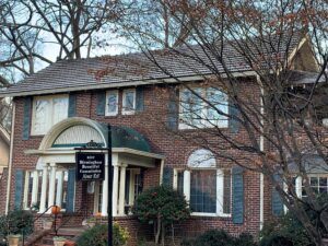 red brick house with frost on roof