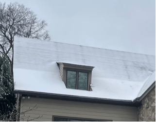 home with frost on roof